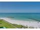Beachfront view with clear water and sandy shoreline at 7100 Sunset Way # 405, St Pete Beach, FL 33706