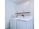 Laundry room with white cabinets and washer/dryer set at 22083 Blazing Star Run, Land O Lakes, FL 34637