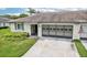 Exterior of a condo with a carport and American flag at 2507 Lancaster Dr, Sun City Center, FL 33573