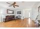 Living area with hardwood floors and comfortable seating at 2507 Lancaster Dr, Sun City Center, FL 33573