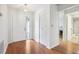 Bright entryway with wood floors and built-in storage at 2507 Lancaster Dr, Sun City Center, FL 33573