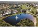 Community clubhouse with scenic lake and golf course views at 2507 Lancaster Dr, Sun City Center, FL 33573