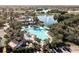 Aerial view of resort-style pool and tennis courts at 2507 Lancaster Dr, Sun City Center, FL 33573