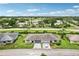 Aerial view of a two-unit home with a two-car garage and driveway at 2507 Lancaster Dr, Sun City Center, FL 33573