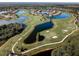 Expansive golf course with serene lakes and homes at 2507 Lancaster Dr, Sun City Center, FL 33573