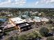 Aerial view of community clubhouse, pool, and surrounding area at 2507 Lancaster Dr, Sun City Center, FL 33573