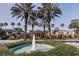 Attractive community entrance with fountain and lush landscaping at 2507 Lancaster Dr, Sun City Center, FL 33573