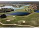 Golf course community with lakes and lush landscaping at 2507 Lancaster Dr, Sun City Center, FL 33573