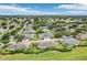 An aerial view of a community with many houses at 2507 Lancaster Dr, Sun City Center, FL 33573
