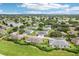 An aerial view of a community with many houses at 2507 Lancaster Dr, Sun City Center, FL 33573