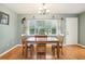 Charming dining area with wood table and chairs, plus large window at 2507 Lancaster Dr, Sun City Center, FL 33573