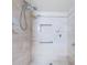 Walk-in shower with tiled walls and safety features at 7037 Sunset S Dr # 602, South Pasadena, FL 33707
