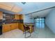Kitchen with granite countertops and light wood cabinets at 7037 Sunset S Dr # 602, South Pasadena, FL 33707