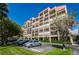 Building exterior with parking and landscaping at 7037 Sunset S Dr # 602, South Pasadena, FL 33707