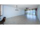 Bright living room with tile floors and water view at 7037 Sunset S Dr # 602, South Pasadena, FL 33707