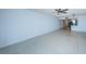 Spacious living room with tile floors and view to kitchen at 7037 Sunset S Dr # 602, South Pasadena, FL 33707