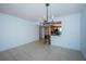 Bright dining area with tile floors and a view into the kitchen at 7037 Sunset S Dr # 602, South Pasadena, FL 33707