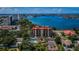 Aerial view of waterfront community with pool and tennis court at 7037 Sunset S Dr # 602, South Pasadena, FL 33707