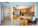 Kitchen boasts granite counters and breakfast bar at 7037 Sunset S Dr # 602, South Pasadena, FL 33707