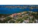 Aerial view showcasing waterfront property, community amenities and surrounding area at 7037 Sunset S Dr # 602, South Pasadena, FL 33707