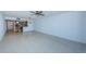 Living room with tile floors and access to kitchen and balcony at 7037 Sunset S Dr # 602, South Pasadena, FL 33707