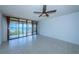 Living room with tile floors and sliding doors to balcony at 7037 Sunset S Dr # 602, South Pasadena, FL 33707