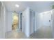 Bright entryway with tile floors, leading to bathroom and closet at 7037 Sunset S Dr # 602, South Pasadena, FL 33707