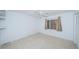 Bright bedroom with tile flooring, ceiling fan, and window coverings at 7037 Sunset S Dr # 602, South Pasadena, FL 33707