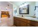 Bathroom with vanity and view into kitchen area at 7037 Sunset S Dr # 602, South Pasadena, FL 33707