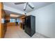 Kitchen with black appliances and wood cabinets at 7037 Sunset S Dr # 602, South Pasadena, FL 33707