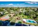 Aerial view of community amenities, including tennis court and swimming pool at 7037 Sunset S Dr # 602, South Pasadena, FL 33707