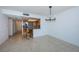 Bright dining area with tile floors and a view into the kitchen at 7037 Sunset S Dr # 602, South Pasadena, FL 33707