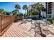 Outdoor patio deck furniture with building view at 7037 Sunset S Dr # 602, South Pasadena, FL 33707