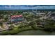 Aerial view of building near waterfront and city skyline at 7037 Sunset S Dr # 602, South Pasadena, FL 33707