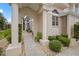 Inviting entryway with arched walkway and manicured landscaping at 1217 Gorda Cay Ln, Punta Gorda, FL 33950