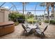 Relaxing patio with hot tub and seating area overlooking canal at 1217 Gorda Cay Ln, Punta Gorda, FL 33950