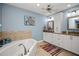 Large bathroom with double vanity, soaking tub, and separate shower at 1217 Gorda Cay Ln, Punta Gorda, FL 33950