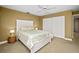 Bedroom with a queen-size bed and coastal decor at 1217 Gorda Cay Ln, Punta Gorda, FL 33950