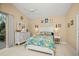 Spacious bedroom with a queen bed, dresser, and access to a patio at 1217 Gorda Cay Ln, Punta Gorda, FL 33950