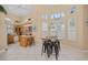 Kitchen with island, wood cabinets, and breakfast nook at 1217 Gorda Cay Ln, Punta Gorda, FL 33950