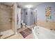 Main bathroom with a large soaking tub, shower, and double sinks at 1217 Gorda Cay Ln, Punta Gorda, FL 33950