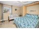 Bedroom with queen bed, sitting area, and ocean decor at 1217 Gorda Cay Ln, Punta Gorda, FL 33950