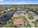 Aerial view of waterfront home with private dock and canal access at 1217 Gorda Cay Ln, Punta Gorda, FL 33950