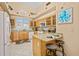 Bright kitchen with light wood cabinets and granite countertops at 1217 Gorda Cay Ln, Punta Gorda, FL 33950