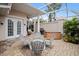 Covered patio features hot tub, seating area, and brick pavers at 1217 Gorda Cay Ln, Punta Gorda, FL 33950