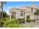 Attractive two-story home with landscaped yard and driveway at 1217 Gorda Cay Ln, Punta Gorda, FL 33950