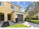 Front exterior of the townhome with garage at 20461 Berrywood Ln, Tampa, FL 33647