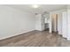 Large bedroom with wood-look floors and access to hallway at 20461 Berrywood Ln, Tampa, FL 33647