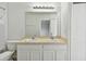 Bathroom with double vanity and a large mirror at 20461 Berrywood Ln, Tampa, FL 33647