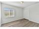 Well-lit bedroom with wood-look floors and double door closet at 20461 Berrywood Ln, Tampa, FL 33647